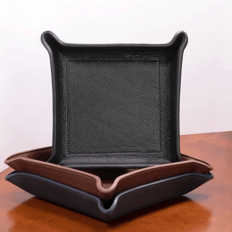 Black and brown leather valet trays